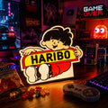 Lampe LED Haribo Collector RGB de LampeGeek avec logo coloré et lumière multicolore, design original et ludique.